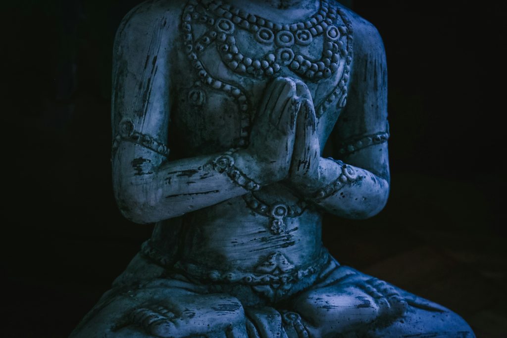 Closeup of statue, hands in prayer pose