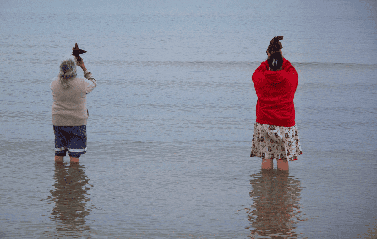 First Nation's women guiding a ceremony to honour the water.